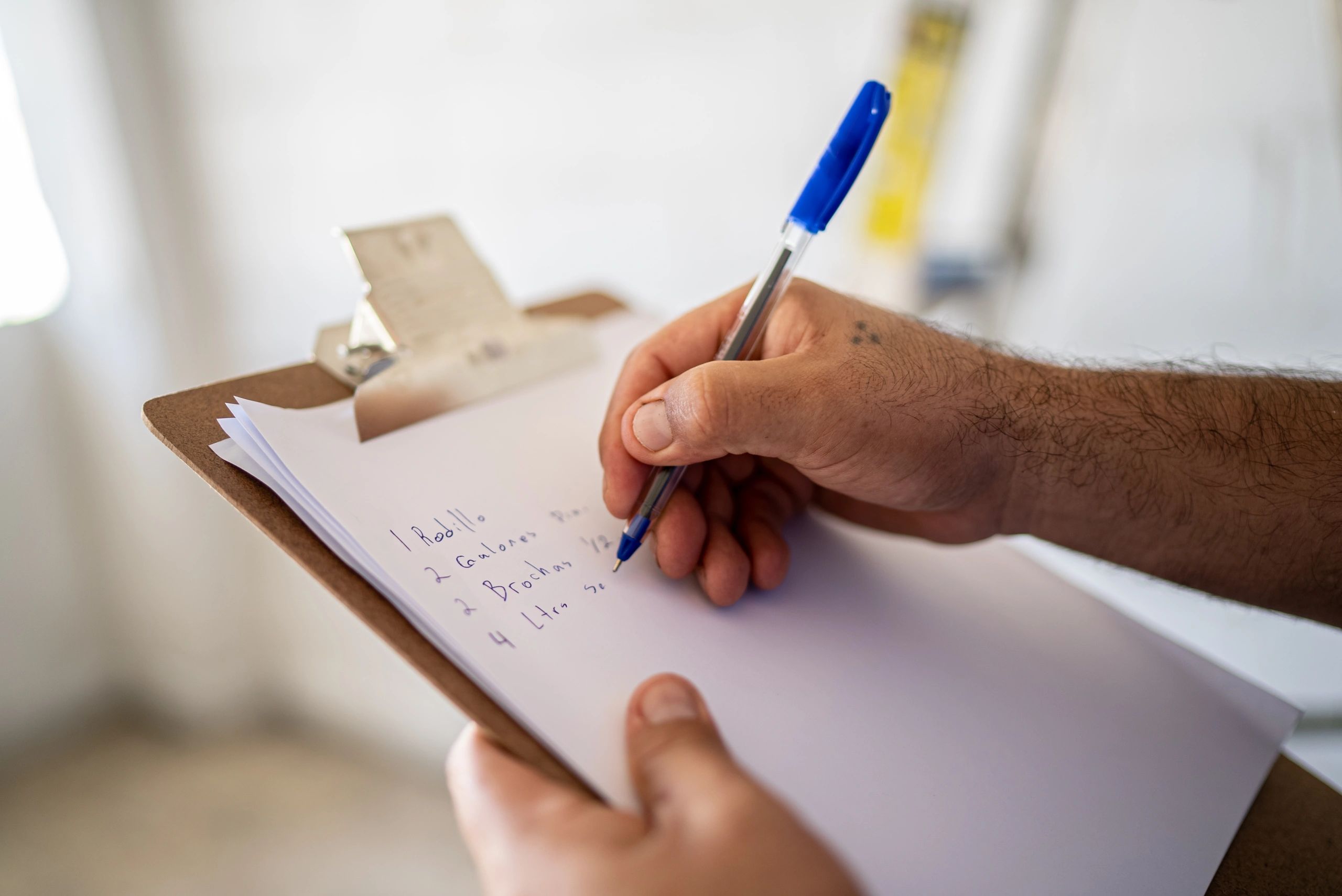 Professional writing on a clipboard