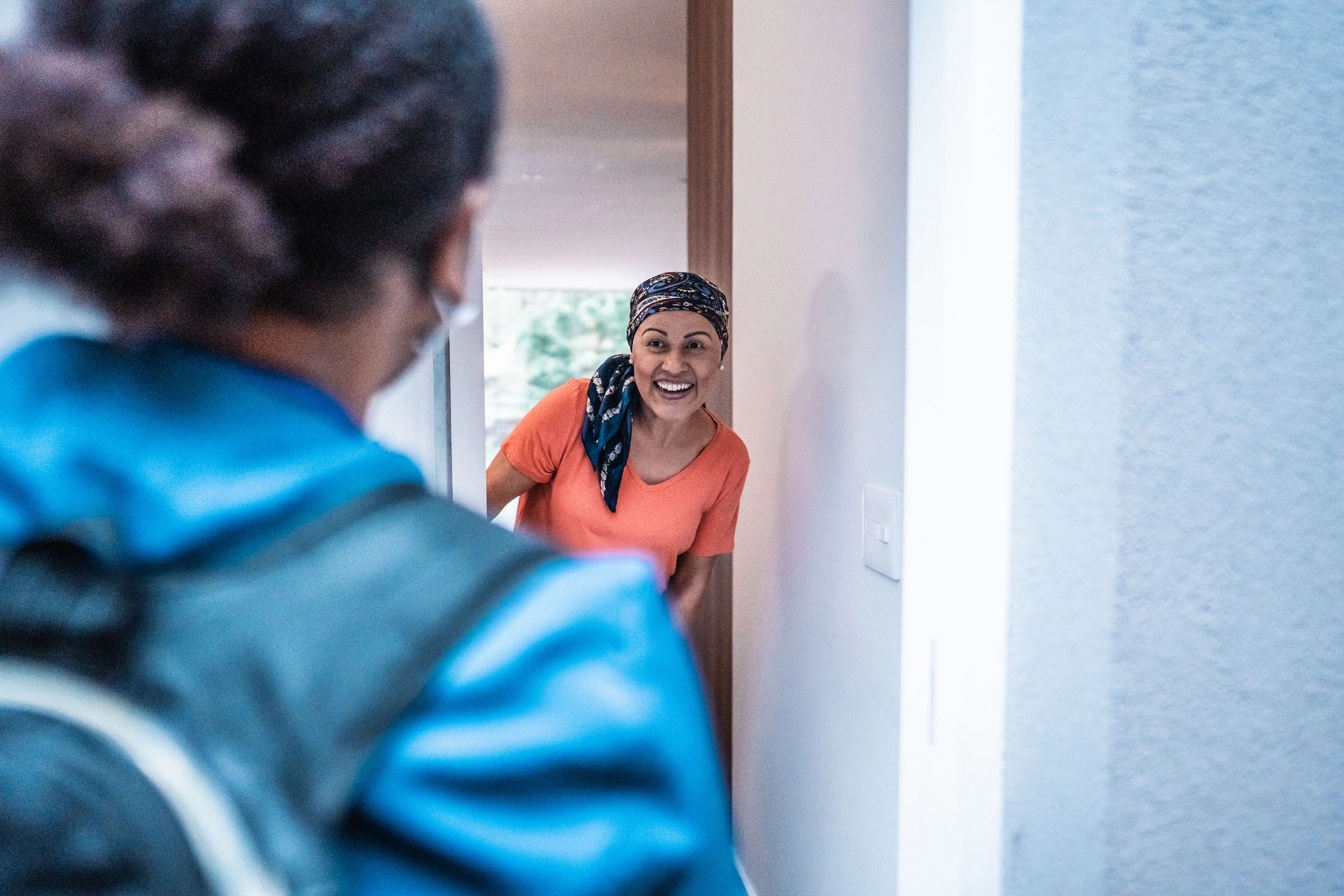 Homeowner speaking with a service professional during an in-home visit